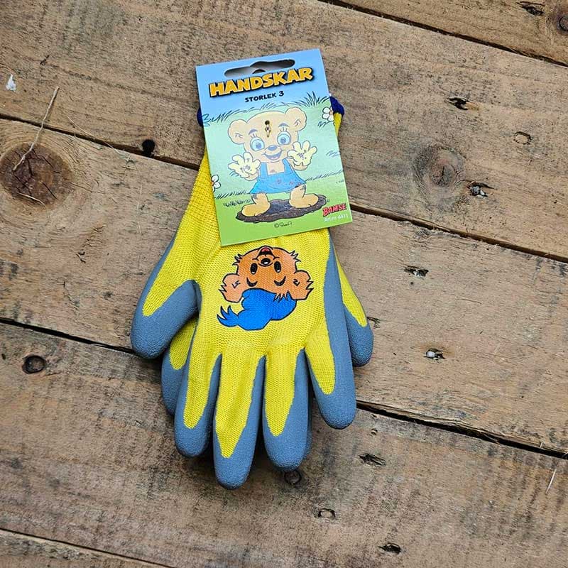 Barnhandske Bamse strl 3, tålig barnhandske med Bamsemotiv. Gummidoppade fingrar